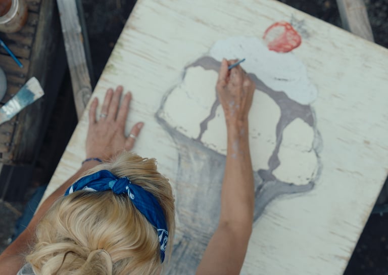 Marla paints the ice cream sign