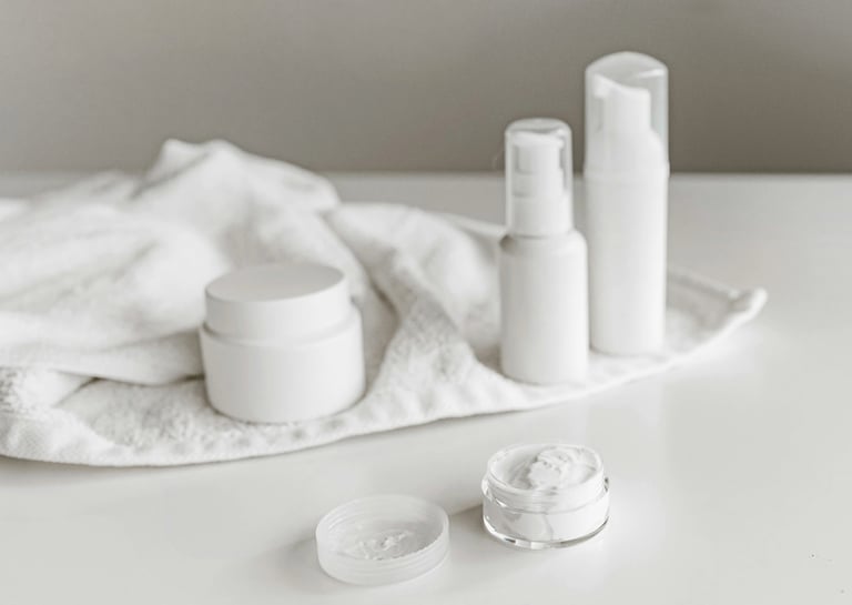 a white table with a towel and some white containers