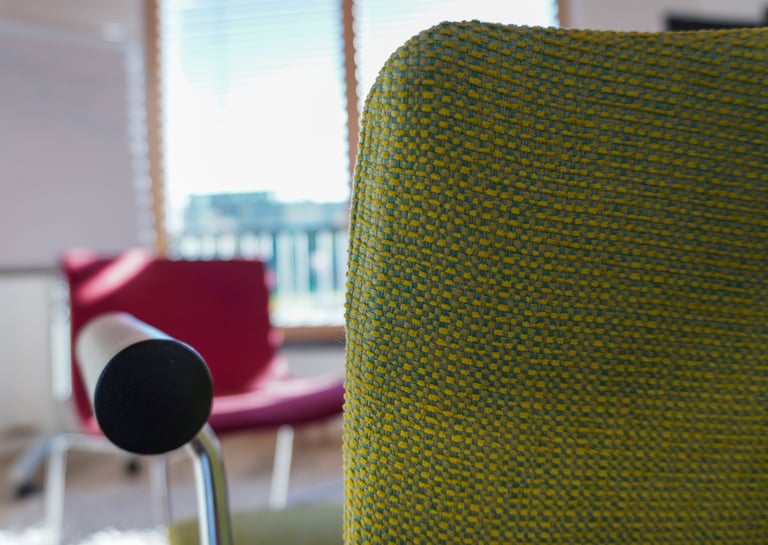 a chair with a microphone and a chair with a microphone