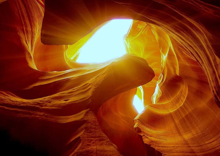 Flagstaff/Page Travel - Light streams down thru the wave like patterns of Antelope Canyon