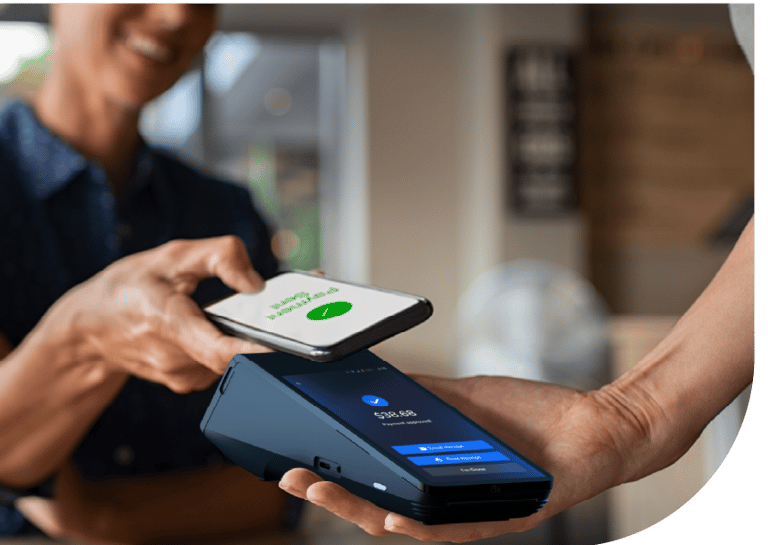 Customer making a contactless mobile payment using a smartphone at a retail POS terminal.