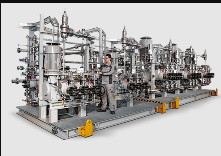 a man in a suit and a suit on a stage