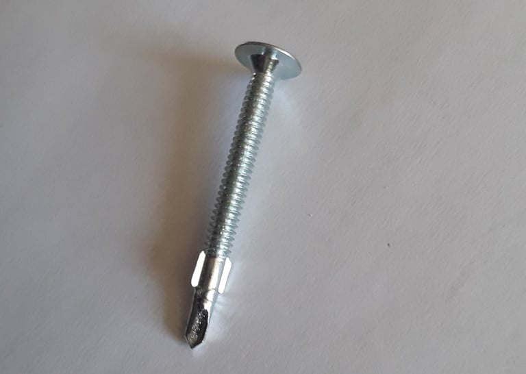Self-drilling metal screw used in drywall and framing installation for renovation projects