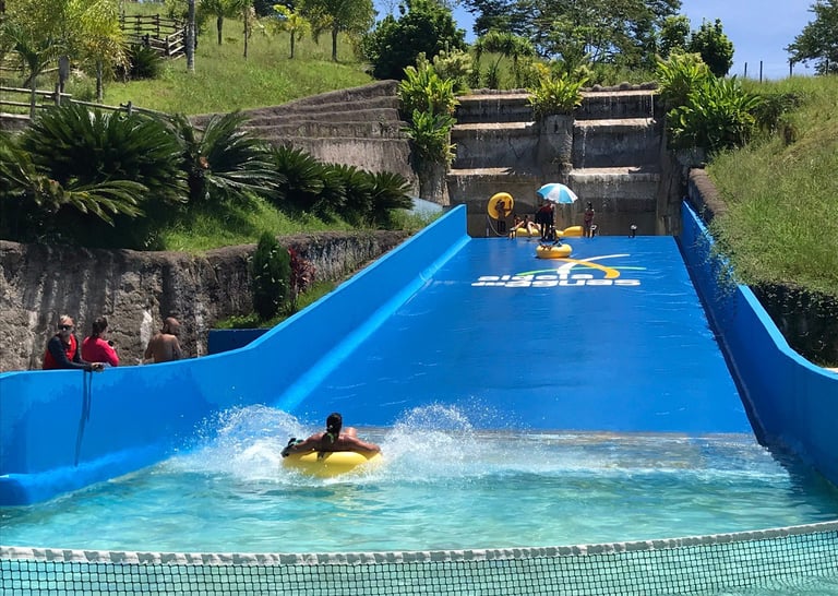 a person on a surfboard in a pool
