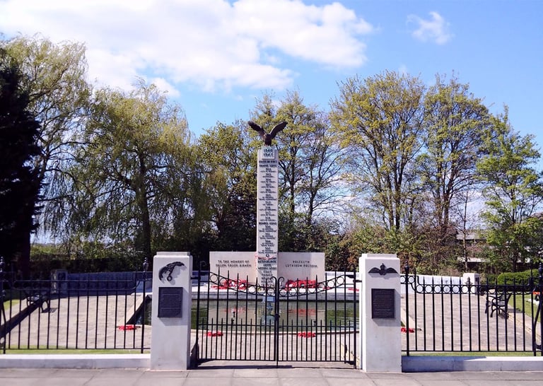 Polish War Memorial at South Ruislip, Hillingond, London. Tall white column, eagle on top.