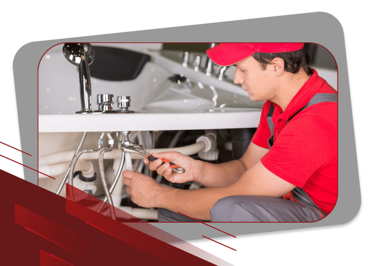 a plumber in a red shirt and a red hat