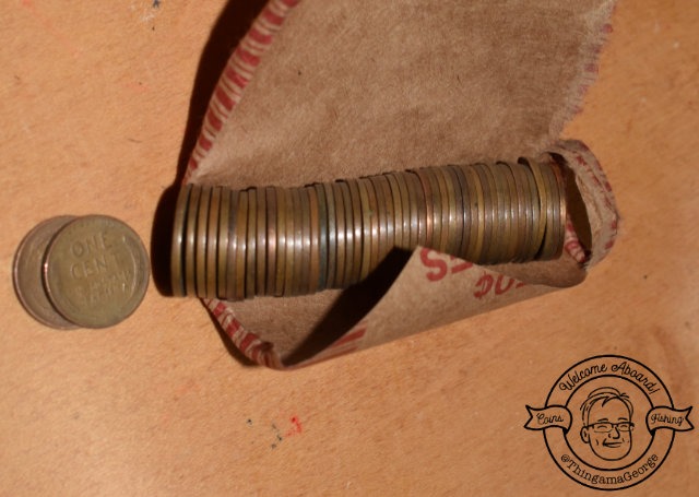 a coin - roll with a Lincoln cent penny coin and a coin
