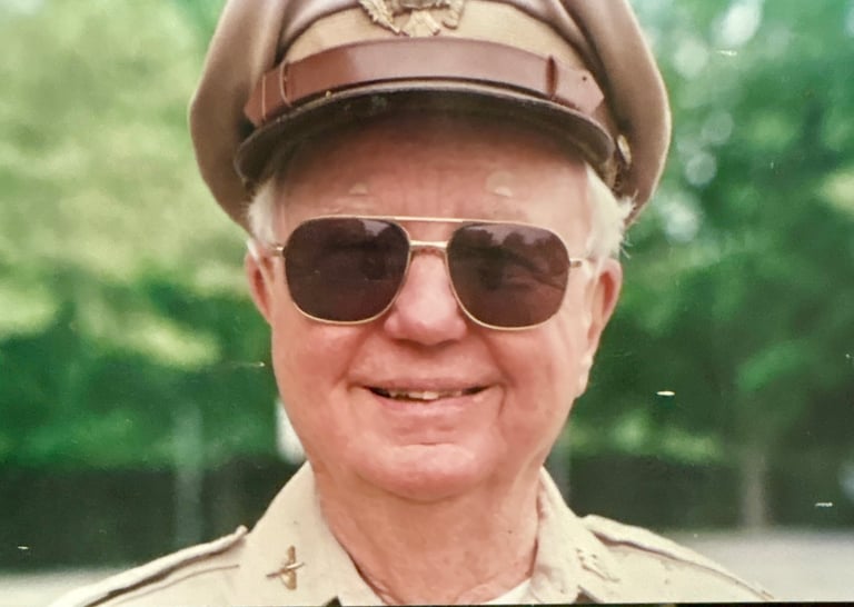 An older man in a police uniform. 