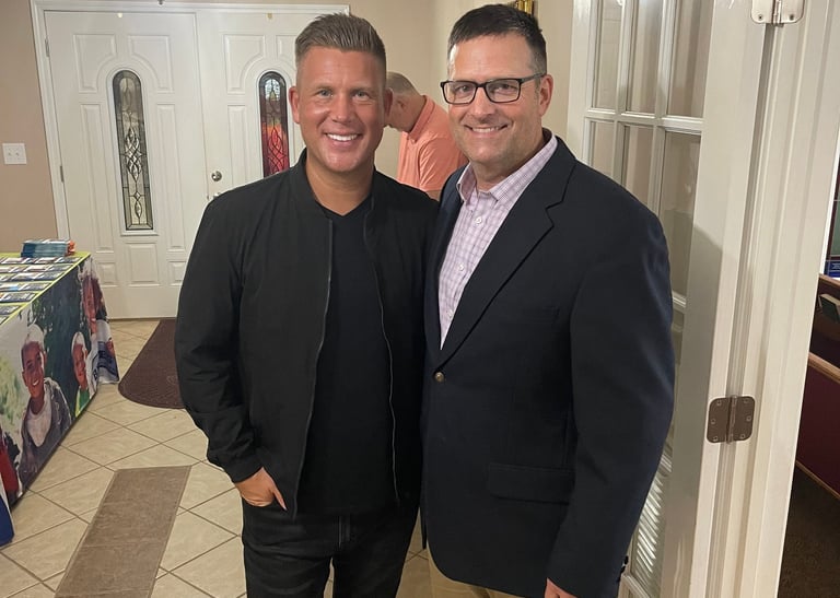 Joseph Habedank and Joe Moseley pose for picture at church