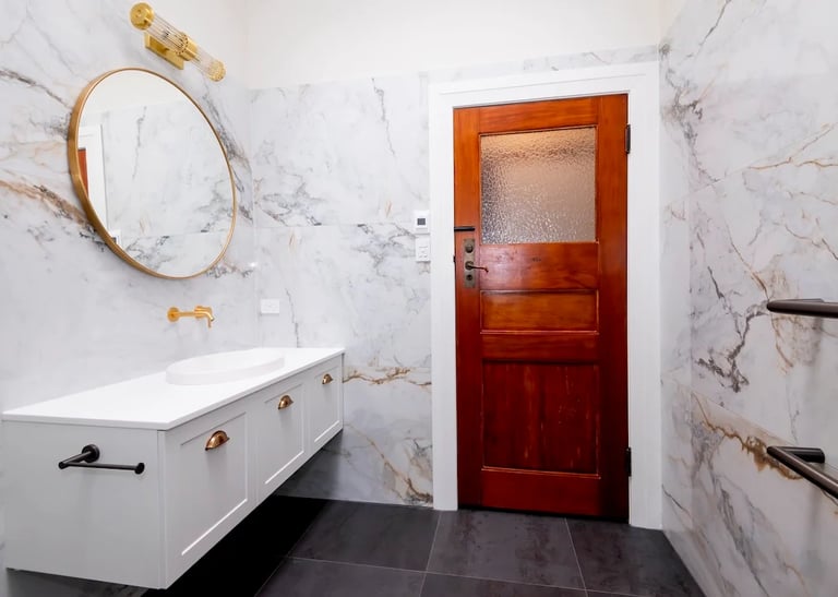 white and gold renovated bathroom