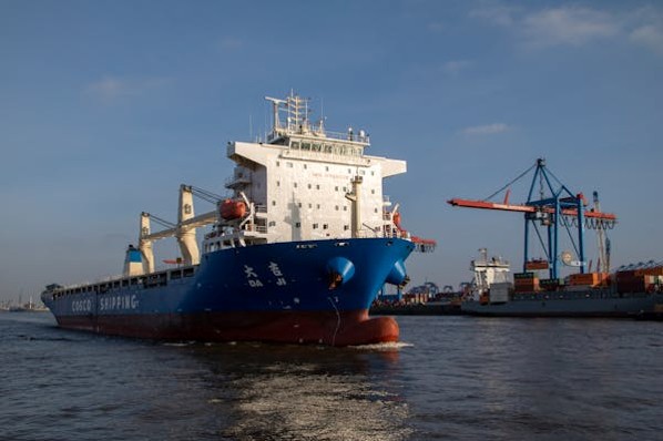 a large ship is docked at a dock