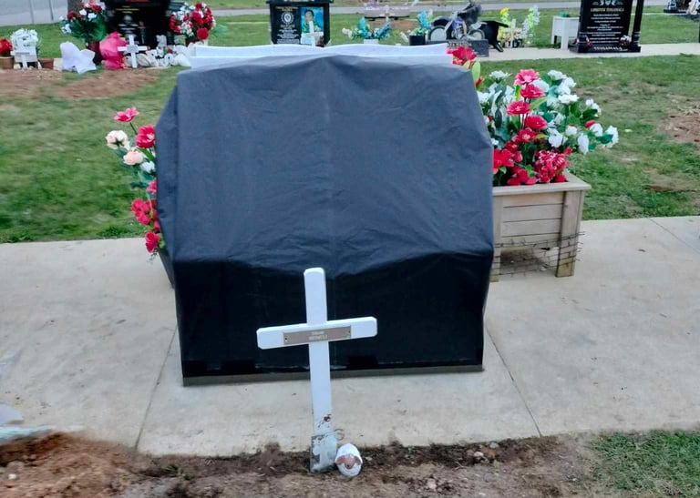 A headstone covered and ready for unveiling