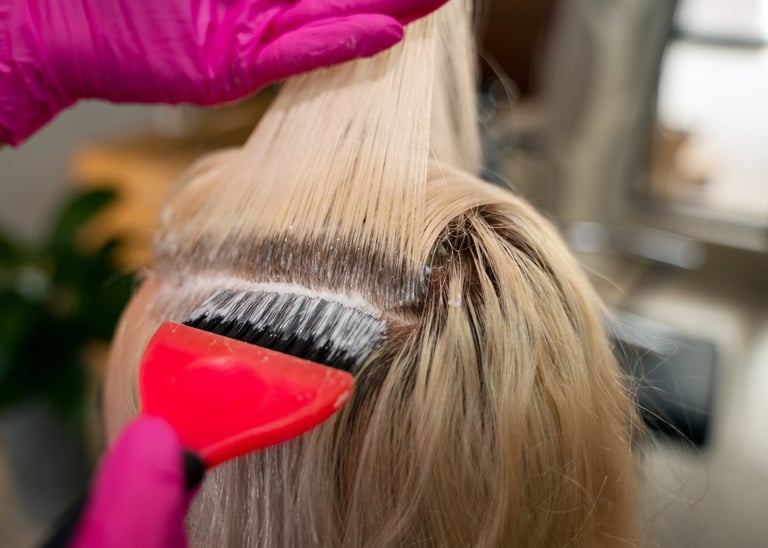 a woman is brushing her hair with a brush