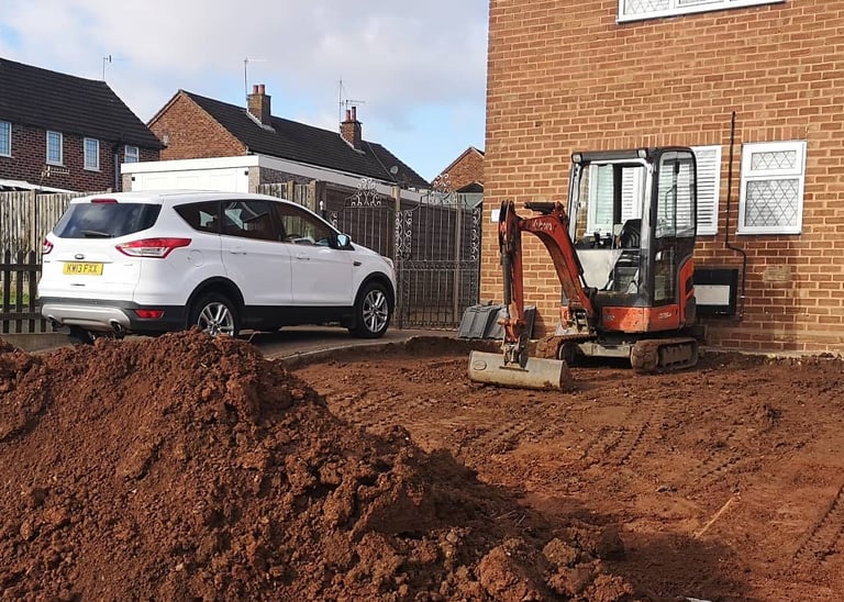Mini digger in use for drainage work in Stourbridge and Lye
