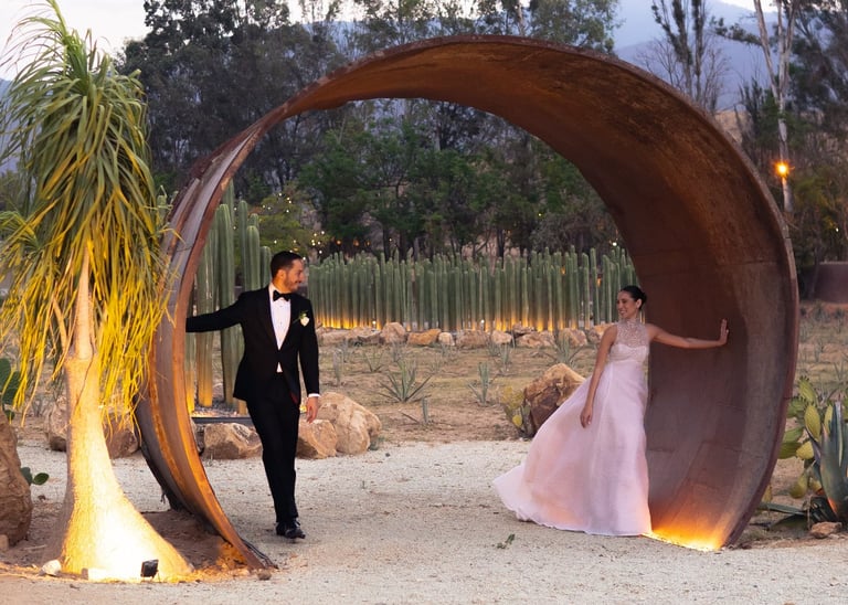 a man in a tuxedo suit and a woman in a pink dress
