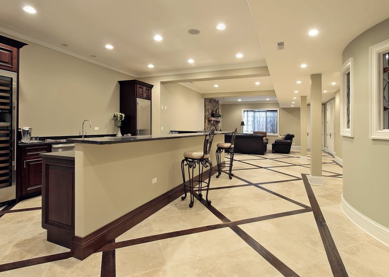 Contemporary finished basement with built-in bar and recording studio area