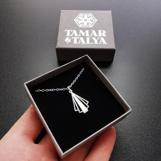 Tamar & Talya silver art deco pendant necklace in a grey gift box for jewelry.