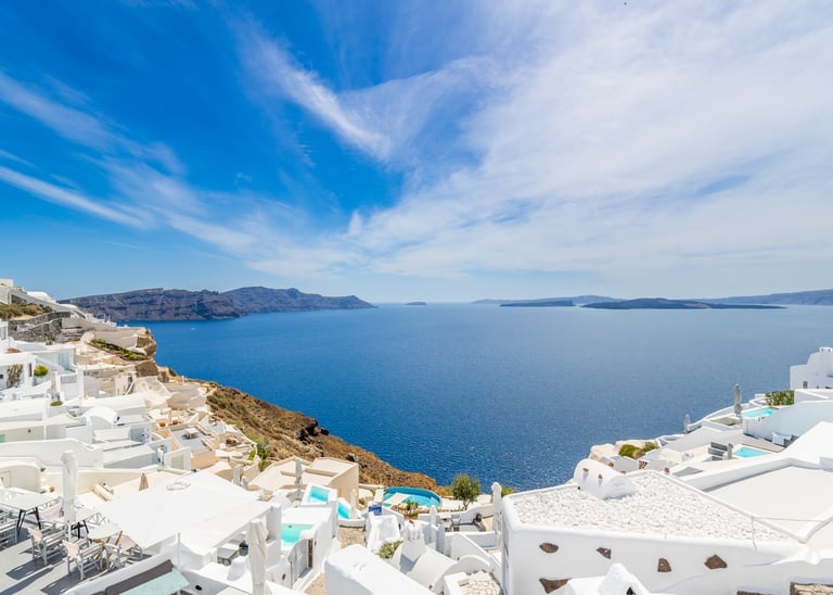 Santorin a view of a view of a sea and a blue sky