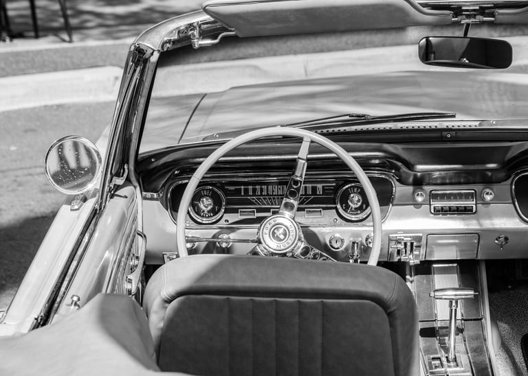 a ford Mustang car dashboard with a steering wheel and dashboard