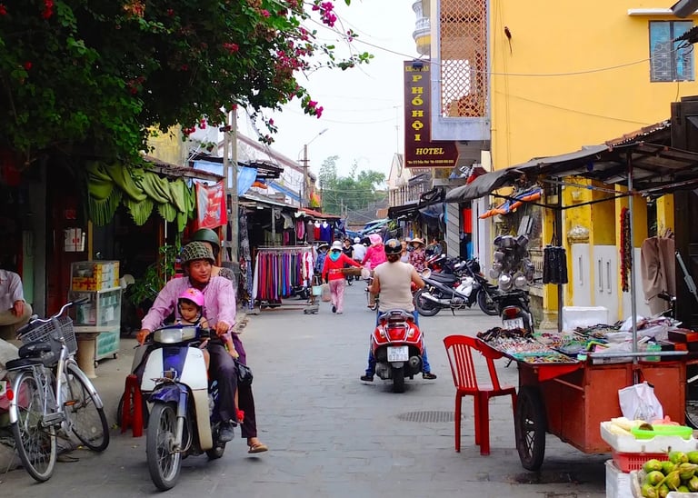 a man and woman riding on a motorbike