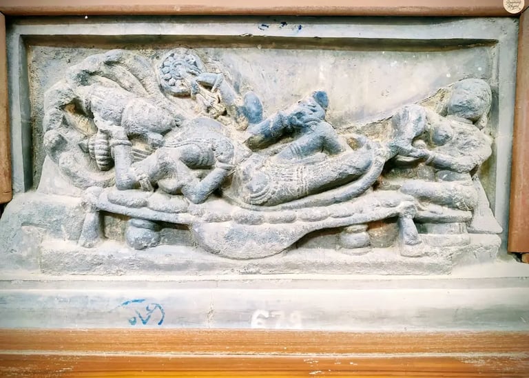 Intricate sculpture of Lord Vishnu resting on serpent Sheshnaga, attended by Goddess Lakshmi. 