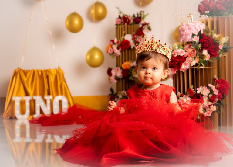 a baby girl wearing a tiablet and a tiable