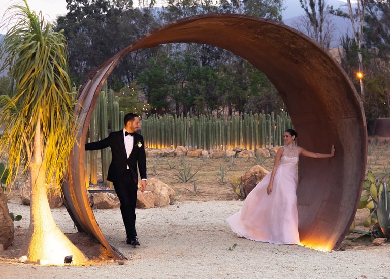 a man in a tuxedo suit and a woman in a pink dress