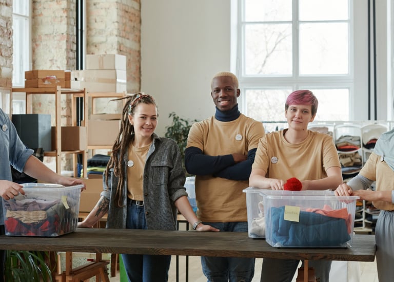 Volunteers in a community organization packing donation boxes