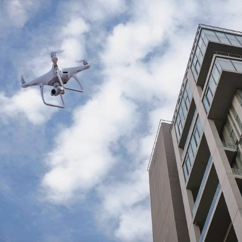 Drone Inspecting Mid Rise Building
