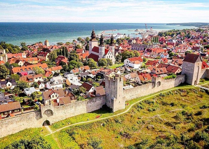 Aerial view of Visby city wall and medieval town architecture on the coast of Gotland, Sweden.