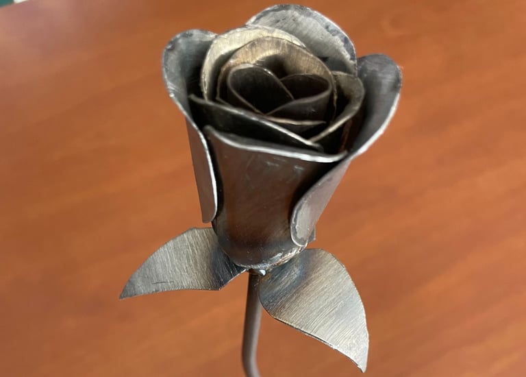 a metal flower on a table 