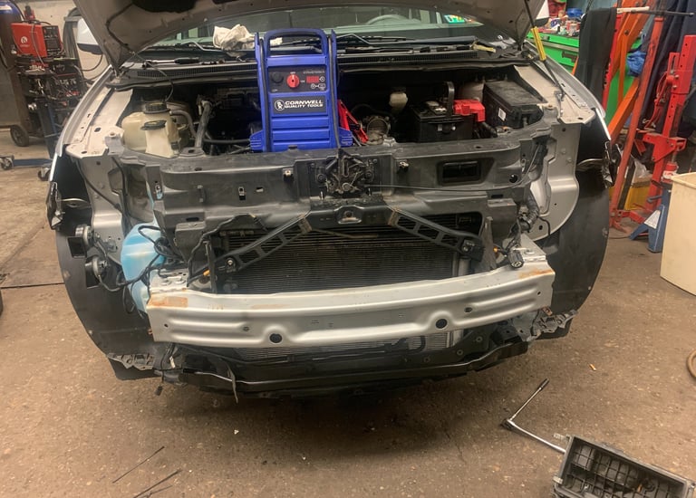 Suv Had bumper removed for headlight services. Battery is being charged