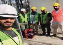 a group of men in safety vests and safety vests