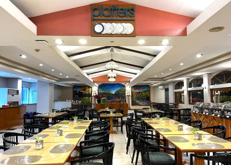 a restaurant with a long table and chairs cozy atmosphere