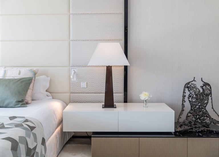 Villa Serenity bedroom with white headboard and soft neutral tones