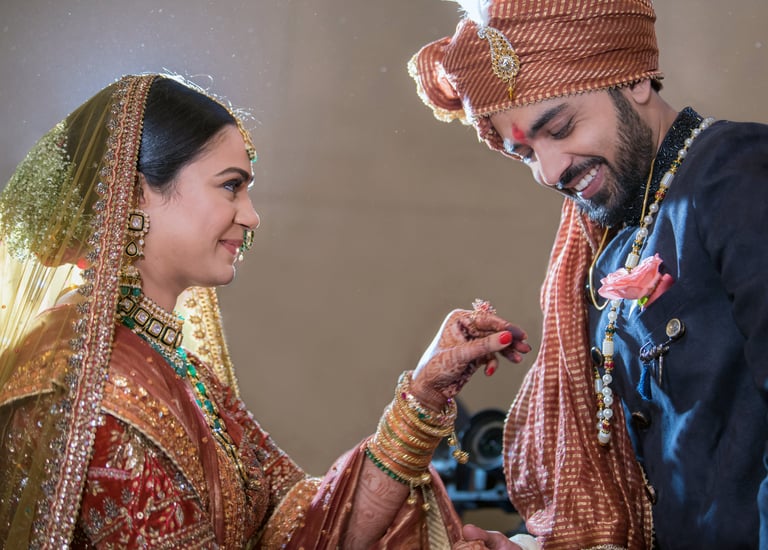 Bride and groom holding hands.