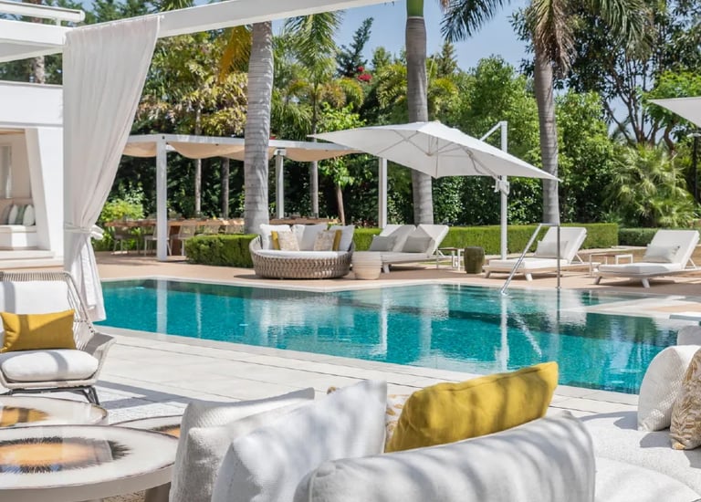 Luxury pool terrace with shaded lounges at Villa Serenity