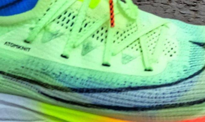 a person wearing a pair of Nike Alphafly trainers