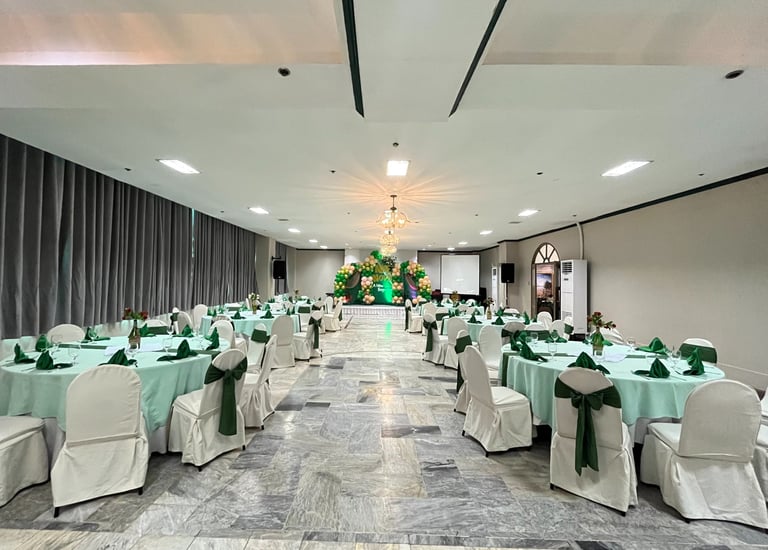 a event ballroom with tables and chairs and a chandelier