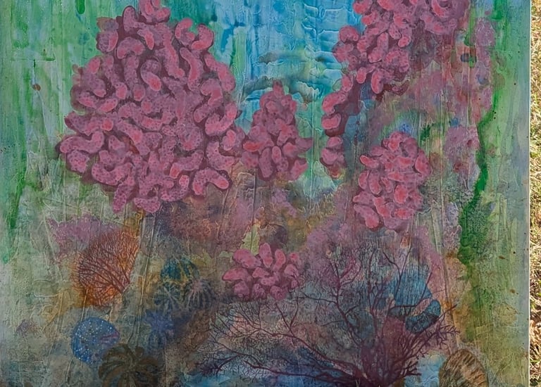 A color dense painting of a coral reef with a clouded blue sky above rendered in gloss acrylics on linen by Kathy LaFollett.