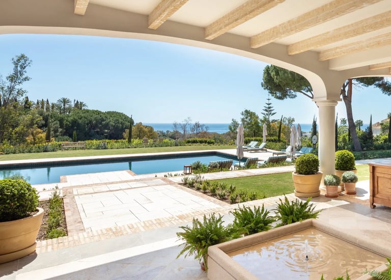 Terrace lounge at Villa La Gratitud with sea views and shaded pergola