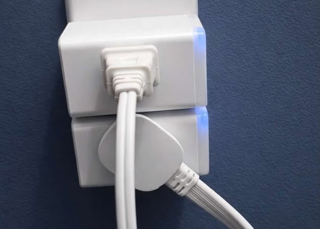 Low profile outlet extender allowing plugs to sit flush against the wall