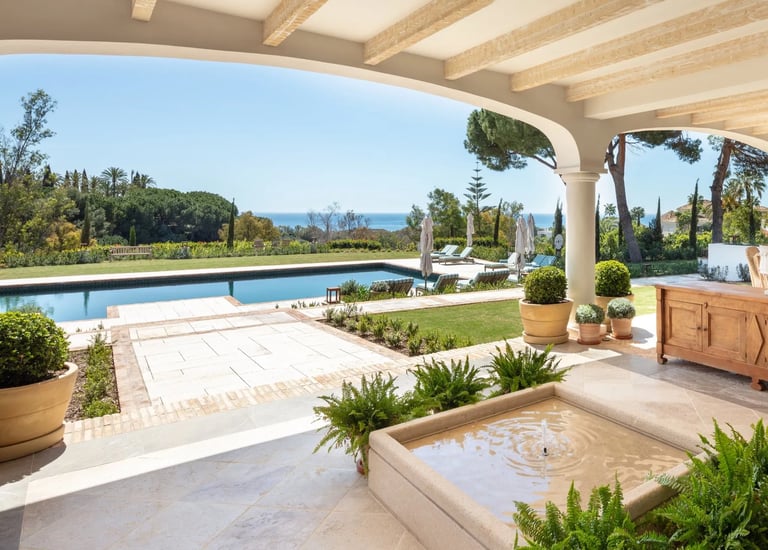 Terrace lounge at Villa La Gratitud with sea views and shaded pergola