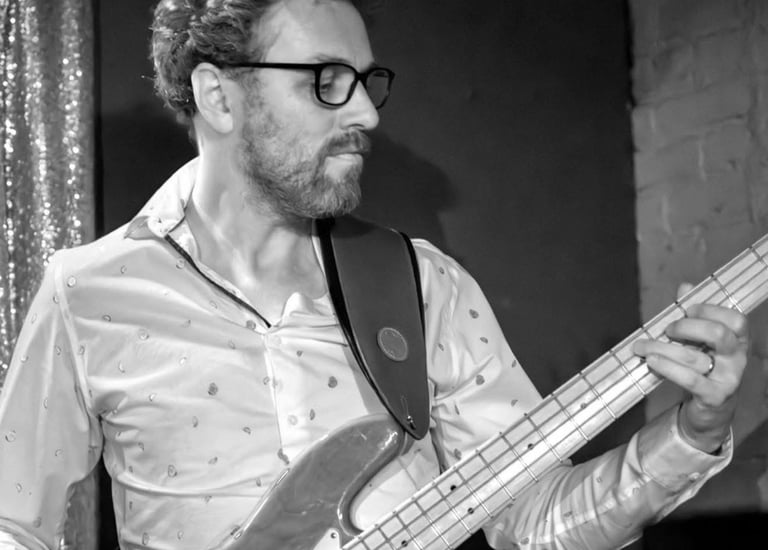 Black and white photo of Hank playing bass