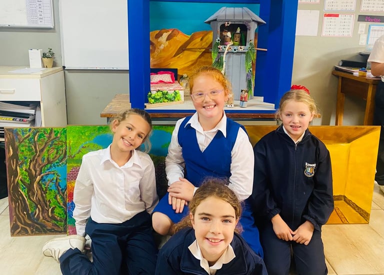 Children next to drama props