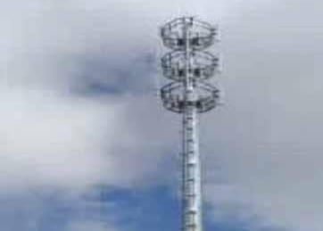 a tall tower with a large metal structure