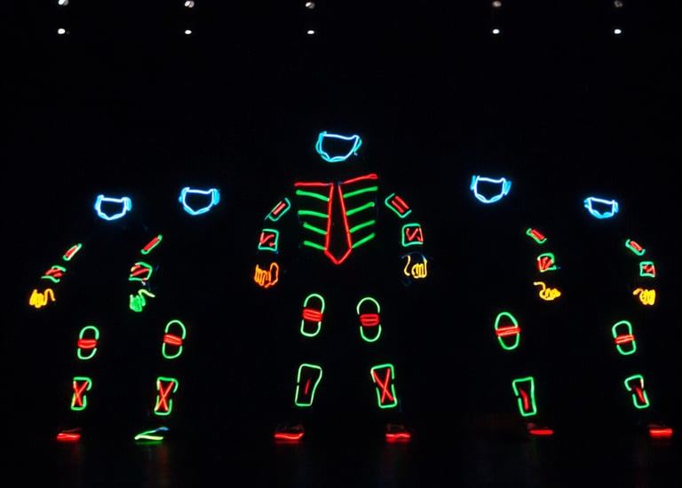 Neon tron act performing illusion show by the glowdiators