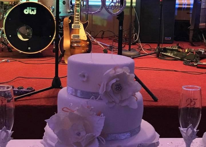 Live band performing at wedding with saxophone and vocalist
