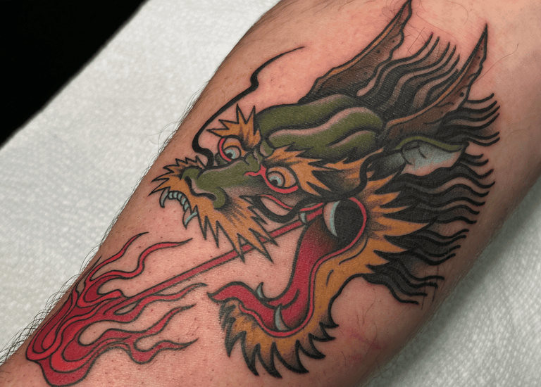 japanese style tradtional dragon head tattoo breathing fire