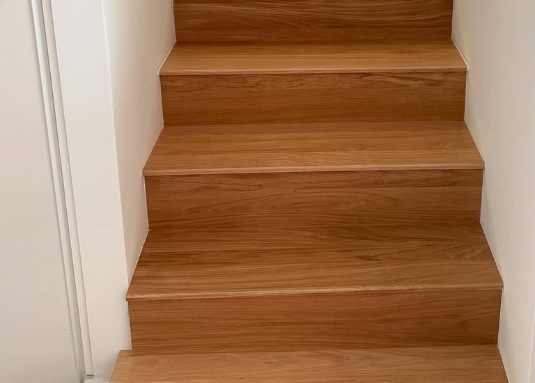 a staircase case with a wooden staircase case
